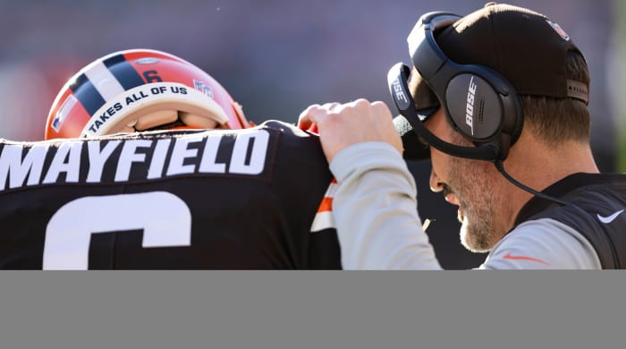Cleveland Browns head coach Kevin Stefanski talks with quarterback Baker Mayfield (6) during the first quarter against the Baltimore Ravens at FirstEnergy Stadium.